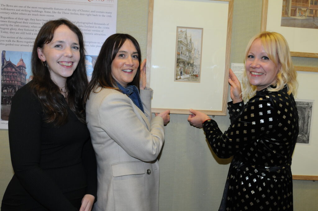L-R Bryony Fisher and Georgia Hayes from Big Heritage giving the Louise Rayner picture to Liz Montgomery from Chester's Grosvenor Museum[86]