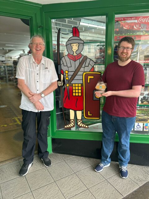 Paul Boyland, owner Chester Model Centre, and son Mark Boyland outside shop with the SME News UK Enterprise Award 2023